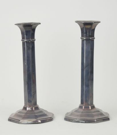 Pair of silver torches with cut sides (?).

Foreign...