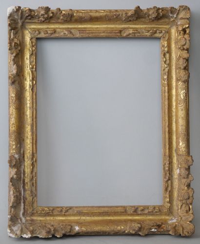 Rectangular frame in carved and gilded wood,...