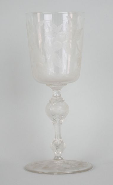 null Lot including an engraved crystal stemmed glass decorated with pomegranates.

19th...