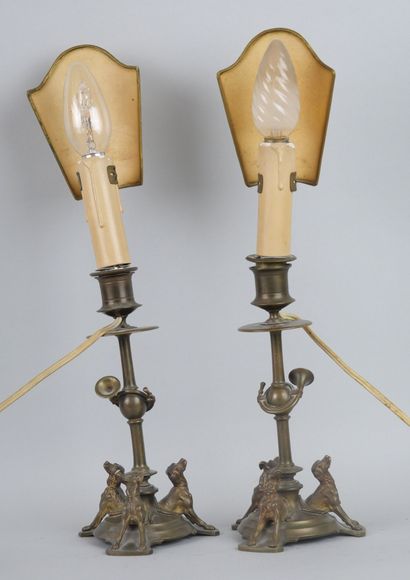 null Pair of bronze torches, the base composed of three hunting dogs.

Napoleon III...