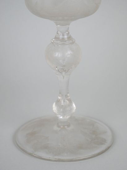 null Lot including an engraved crystal stemmed glass decorated with pomegranates.

19th...