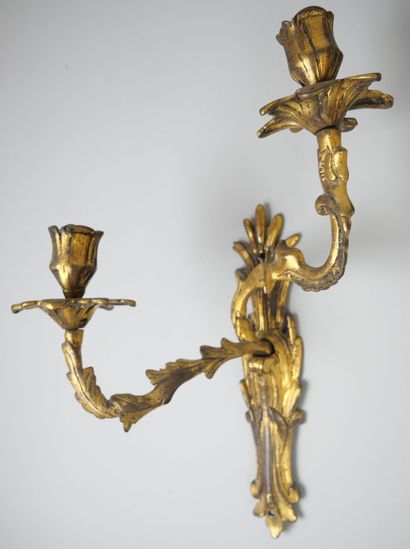 null Pair of small sconces with two arms of light in gold varnished bronze.

Louis...