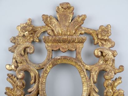 null A carved and gilded wood stoup with an openwork decoration of scrolling foliage.

Eighteenth...