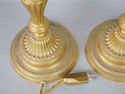 null Pair of gilt bronze torches.

Louis XVI style, 19th century.

(Drilled for electricity,...
