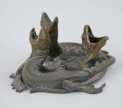 null Group in bronze with a brown-green patina representing a frog accompanied by...