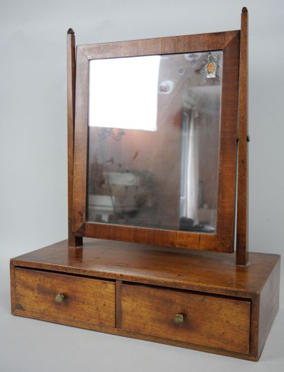 null Mirror toilet in mahogany veneer resting on a box containing two drawers. The...