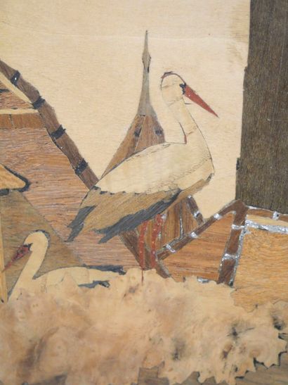 null LUX (XXth), Alsatian school,

View of a church and storks in Alsace, 

Marquetry...
