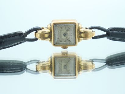 null AMEX E.B Switzerland 
Lady's watch, the square dial in gold 750 thousandth,...