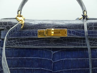 null HERMES PARIS
KELLY bag in navy blue crocodile, with pocket lock and shoulder...