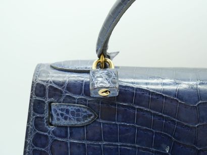 null HERMES PARIS
KELLY bag in navy blue crocodile, with pocket lock and shoulder...