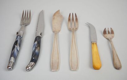 null Suite of mismatched flatware including: 
LAGUIOLE. 12 knives and 12 forks in...