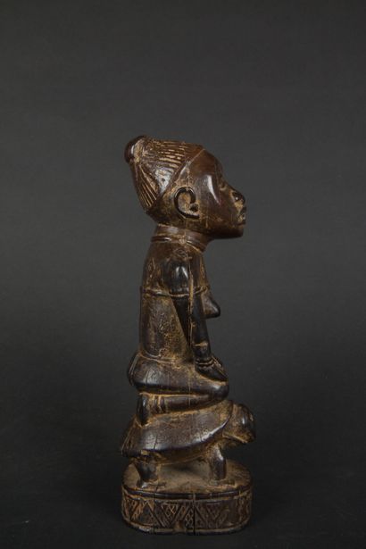null DEMOCRATIC REPUBLIC OF THE CONGO 
Female figure on a tortoise in carved wood
Kongo
Beginning...