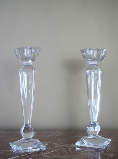 Pair of glass candlesticks on a square base....