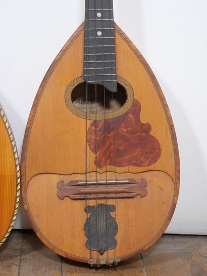 null Two flat mandolins, one bearing the label of Paul Beuscher. 
Dimensions: 71...
