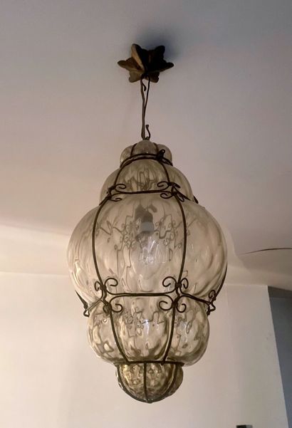 null Lantern in blown glass and wrought-iron frame with scroll decoration. 
Height:...