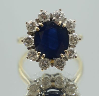 null 750 thousandths white gold ring set with a cushion sapphire in a setting of...