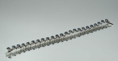 null Articulated bracelet in 750 thousandths white gold entirely set with a line...