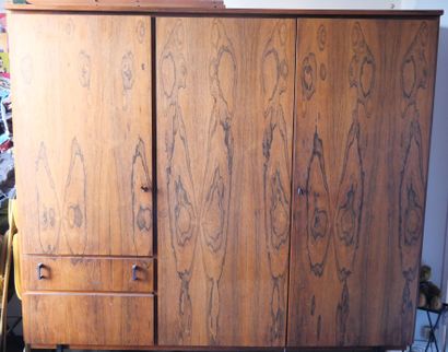 null Exotic wood wardrobe opening to three full doors forming a closet, and shelves;...