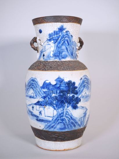 null CHINA. NANKIN 
Stoneware baluster vase with blue cameo crackle decoration of...
