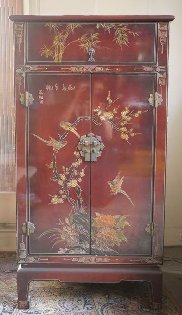 null CHINA 
Red lacquered wood music cabinet decorated with birds on branches, opening...