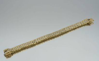 null Ribbon bracelet in two-tone 750 thousandths gold with geometric mesh. 
Length:...