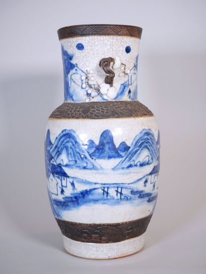 null CHINA. NANKIN 
Stoneware baluster vase with blue cameo crackle decoration of...
