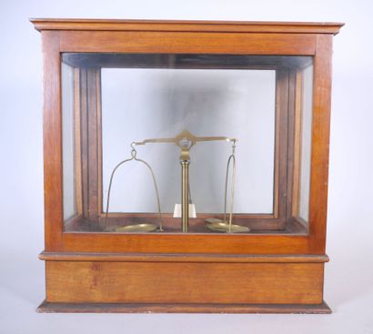 null Brass precision trebuchet balance in a wooden display case opening to a drawer,...