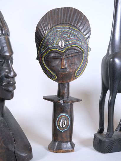 null AFRICAN ART 
Reunion of 6 black stained wood subjects representing a giraffe,...