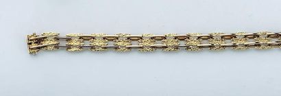 null Bracelet articulé en or jaune 18K (750/1000e) à motif de grains allongés.

Poids...