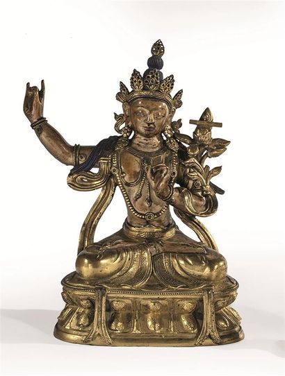 null Statuette de Manjusri en bronze doré et laqué, assis en vajrasana sur un double...