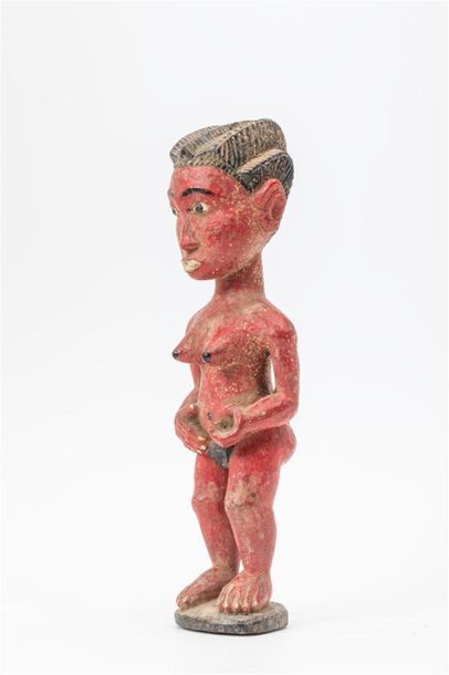 null Statuette en bois à patine rouge représentant une femme.
Culture Baoulé, Côte...