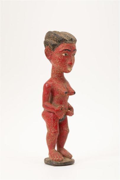 null COTE D'IVOIRE, Culture Baoulé. 
Statuette en bois à patine rouge représentant...