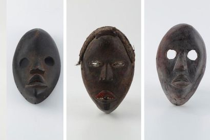 null DAN - COTE D'IVOIRE
Trois masques en bois à patine naturelle dont un masque...