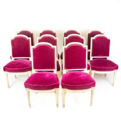Suite de dix chaises Set of ten cream lacquered wooden chairs, covered with purple...