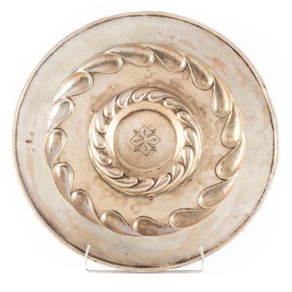 PLAT A round silver dish decorated with two rows, in reverse order, of a drop of...