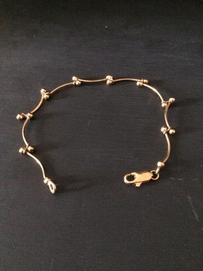 null Bracelet fantaisie articulé en métal doré 
L. : 18,5 cm
