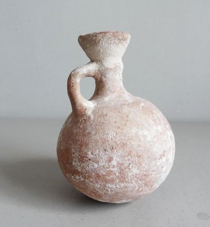 null Terracotta jug with rounded rumen and side
grip Antique work probably Roman...