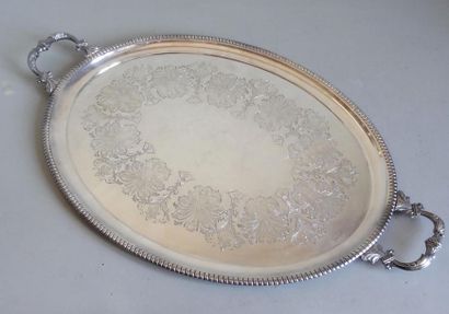 null Large oval serving tray in silver plated metal edged with a frieze of gadroons...
