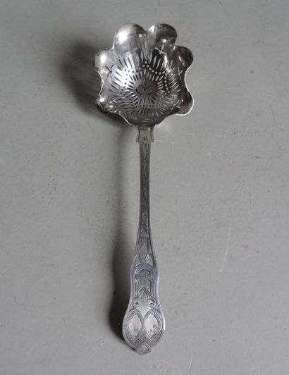 null Silver sugar spoon. The round spoon with its moving edge is pierced with flame...