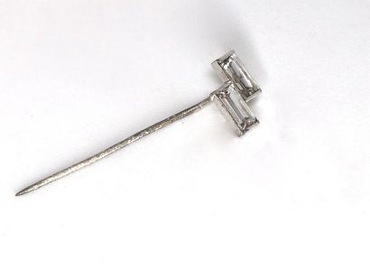 null A white gold tie pin finished with two synthetic baguette-shaped stones.
