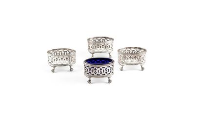 null Set of four silver plated openwork salt shaker frames on claw feet English
work...