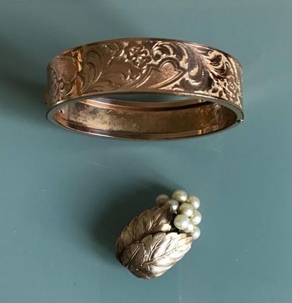 null Gold-plated metal bracelet with engraved decoration of flowers and a "lily of...