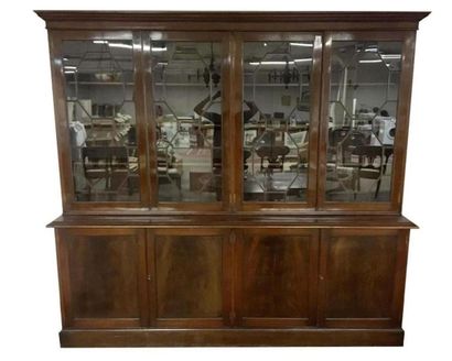 null Large mahogany and mahogany veneer two-body breakfront bookcase opening in the...