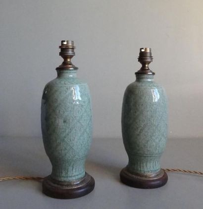 null CHINA
Pair of celadon green enamelled stoneware vases with tone-on-tone
chiselled...