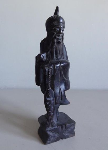 null CHINA
Statuette of fisherman in blackened wood.
H. 30 cm