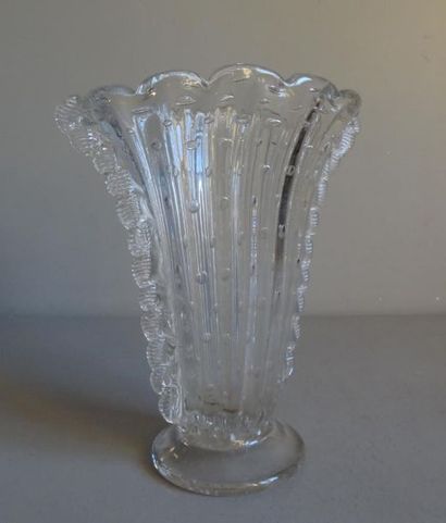 null Blown and bubbled glass vase slightly fan-shaped with ribs and serrated
side...