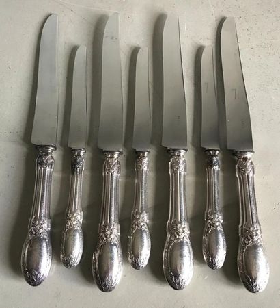 null Set of four table knives and three cheese knives, with steel blade on a silver...
