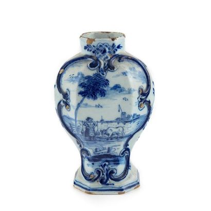 null DELFT
Blue and white earthenware vase with landscape decoration. 18th
H. 19...
