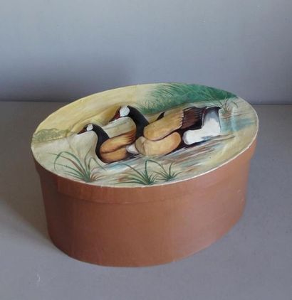 null Large covered oval shaped box made of papier-mâché decorated with ducks in slight...