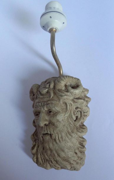 null Ceramic wall light in the shape of a faun's head surmounted by a brass rod.
H....